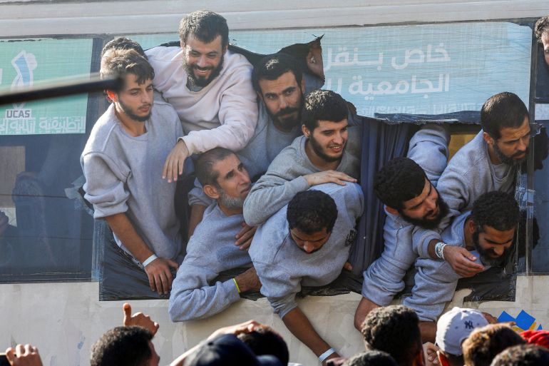 re-1-1760360373 Freed Palestinian prisoners look out of a bus after they were released by Israel as part of a hostages-prisoners swap and a ceasefire deal between Hamas and Israel, in Khan Younis in the southern Gaza Strip, October 13, 2025. REUTERS/Mahmoud Issa TPX IMAGES OF THE DAY