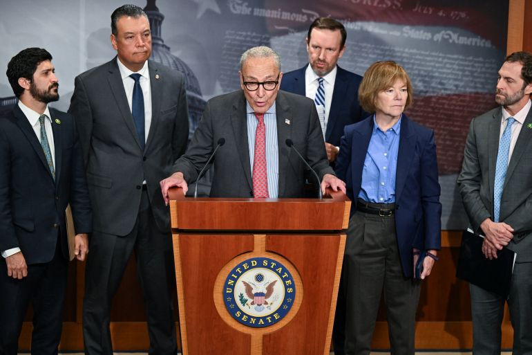 reuters_68cedbb5-1758387125 U.S. Senate Minority Leader Chuck Schumer (D-NY) surrounded by other democratic members of congress, speaks at a press conference on plans to introduce a legislation to protect individuals and groups free speech rights from "politically motivated targeting and prosecution by the federal government," on Capitol Hill in Washington, D.C., U.S., September 18, 2025. REUTERS/Annabelle Gordon