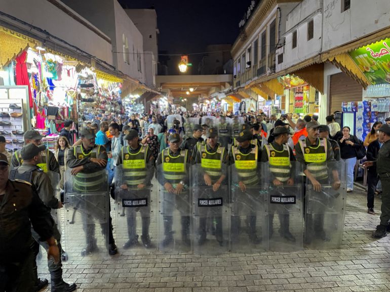 FILE PHOTO: Members of the security forces stand guard as they prevent a protest demanding reforms in education and health from taking place, in Rabat, Morocco, September 29, 2025. REUTERS/Ahmed El Jechtimi/File Photo