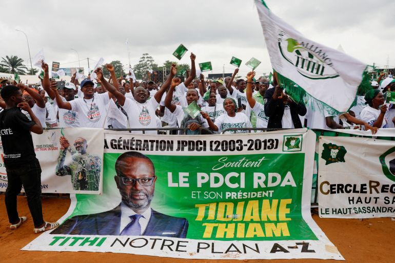 FILE PHOTO: Supporters of Tidjane Thiam, President of the Democratic Party of Cote d'Ivoire (PDCI), gesture during a rally of a coalition of political parties calling for political dialogue with the government to ensure an inclusive and peaceful election in October 2025, in Abidjan, Ivory Coast, May 31, 2025. REUTERS/Luc Gnago/File Photo
