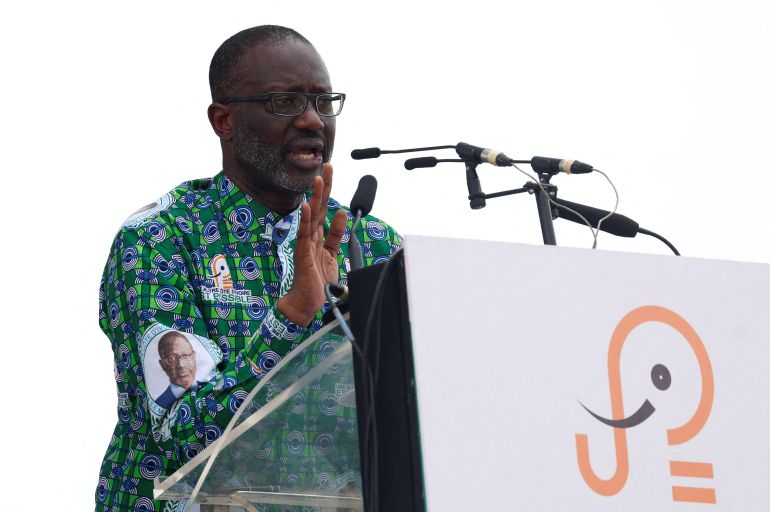 FILE PHOTO: Tidjane Thiam, president of the PDCI (Democratic Party of Cote d'Ivoire), speaks during a meeting as the country prepares for the presidential election in Yopougon, Abidjan, Ivory Coast, February 15, 2025. REUTERS/Luc Gnago/File Photo