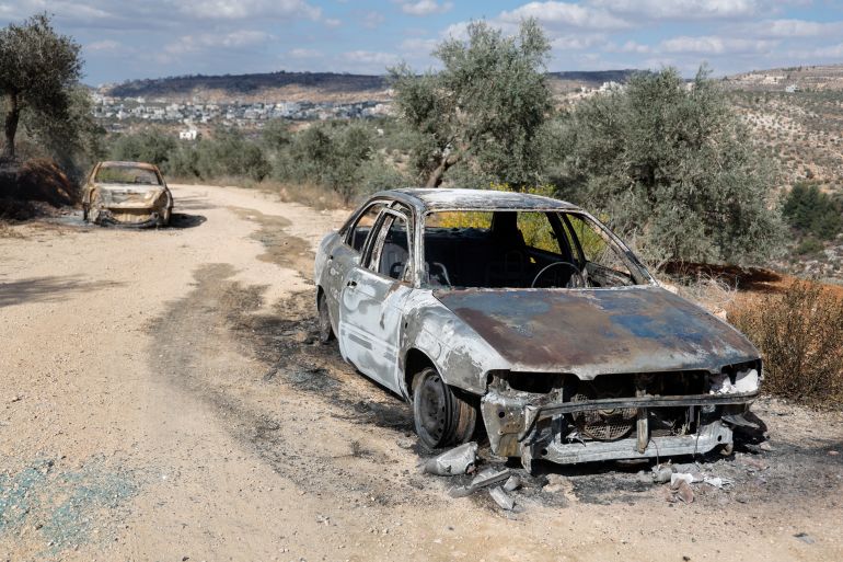Burned Palestinian vehicles after Israeli settlers attacked olive pickers in the village of Beita, according to Palestinian media, in the Israeli-occupied West Bank, October 10, 2025. REUTERS/Raneen Sawafta