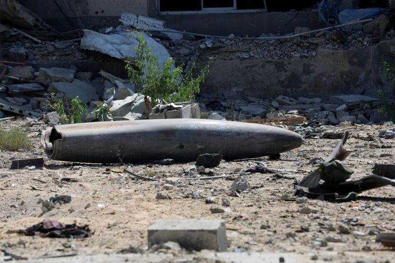 The remains of a munition lie among the rubble, following Israeli forces' withdrawal from the area, after Israel and Hamas agreed on the Gaza ceasefire, in Khan Younis, in the southern Gaza Strip, October 10, 2025. REUTERS/Ramadan Abed