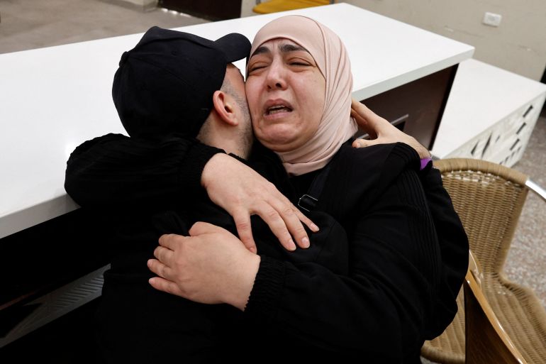 reuters_68ece652-1760355922 A freed Palestinian is hugged by a relative after he was released from an Israeli jail as part of a hostages-prisoners swap and a ceasefire deal in Gaza between Hamas and Israel, in Ramallah, in the Israeli-occupied West Bank, October 13, 2025. REUTERS/Ammar Awad