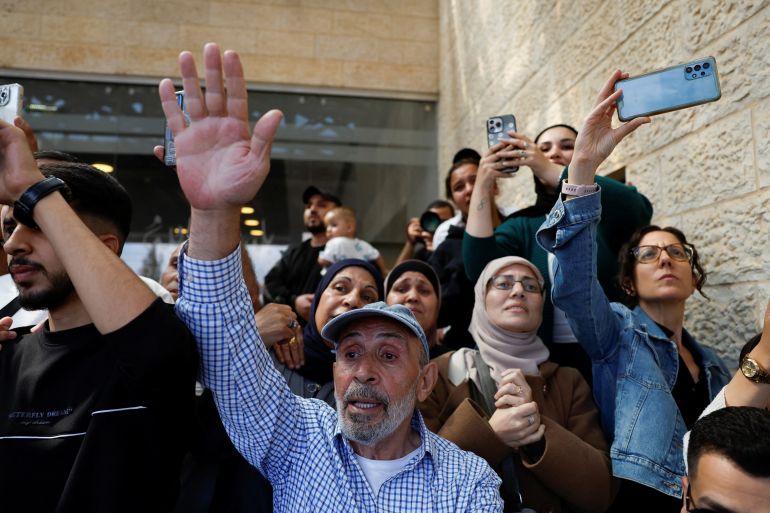 reuters_68ecea3b-1760356923 People react as freed Palestinian prisoners arrive after being released from an Israeli jail as part of a hostages-prisoners swap and a ceasefire deal in Gaza between Hamas and Israel, in Ramallah, in the Israeli-occupied West Bank, October 13, 2025. REUTERS/Mohammed Torokman