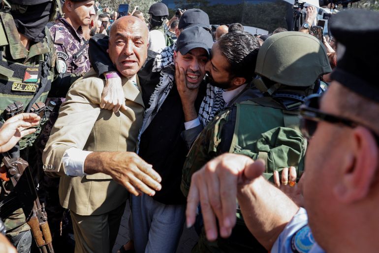 reuters_68ecea4a-1760356938 A freed Palestinian prisoner is greeted after he was released from an Israeli jail as part of a hostages-prisoners swap and a ceasefire deal in Gaza between Hamas and Israel, in Ramallah, in the Israeli-occupied West Bank, October 13, 2025. REUTERS/Ammar Awad