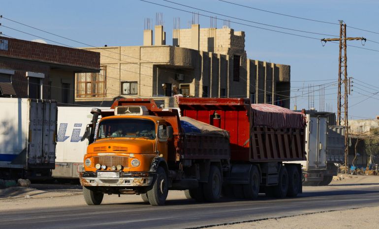 reuters_68f263c5-1760715717 A Mercedes truck of the type that carried thousands of bodies from the Qutayfah mass grave to a secret desert site created by the Assad government, near the town of Dhumair, Syria, February 27, 2025. REUTERS/Khalil Ashawi To match Special Report SYRIA-SECURITY/MASS GRAVES