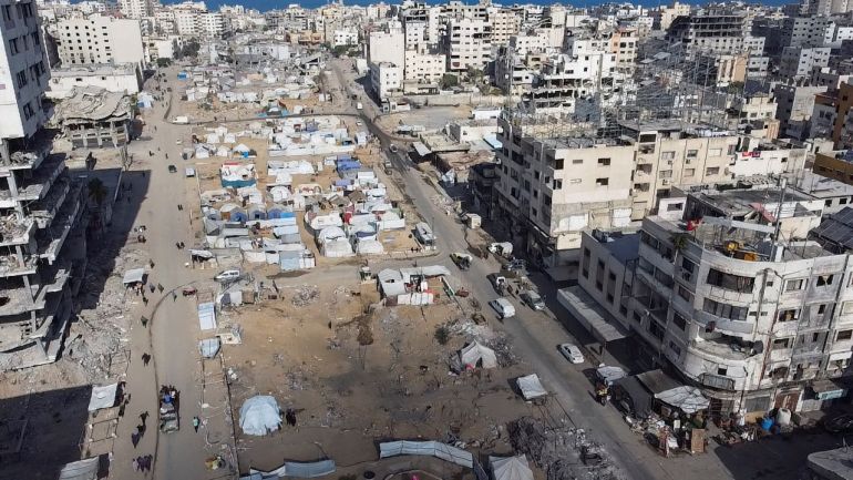 reuters_68f491eb-1760858603 A drone view shows tents of displaced Palestinians and a destroyed city, following the withdrawal of the Israeli forces from the area, amid a ceasefire between Israel and Hamas in Gaza, in Gaza City, October 18, 2025. REUTERS/Dawoud Abu Alkas