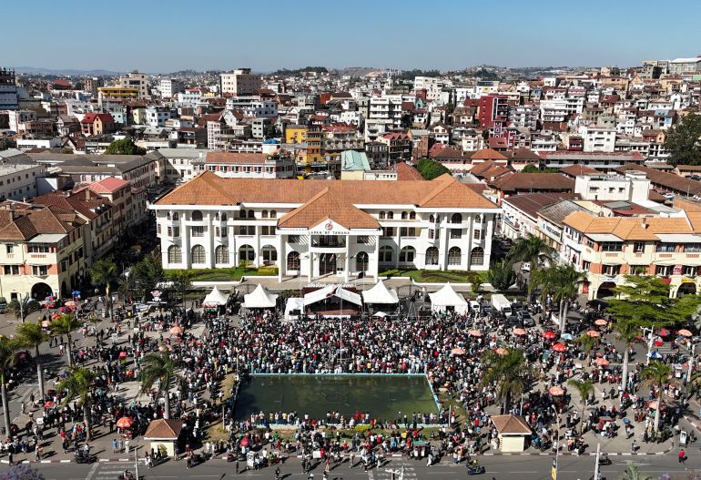reuters_68f4ff60-1760886624 A drone view shows protesters gathering outside the town hall on Independence Avenue during a nationwide youth-led demonstration against frequent power outages and water shortages, in Antananarivo, Madagascar, October 14, 2025. REUTERS/Siphiwe Sibeko