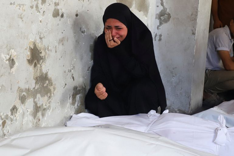 Tasneem Ayad, a Palestinian woman, bids farewell to her brother Abdullah, who was killed in a deadly overnight Israeli strike on a building where displaced people were taking shelter, amid an Israeli military operation, according to medics, at Al-Ahli Arab Hospital in Gaza City, September 24, 2025. REUTERS/Ebrahim Hajjaj