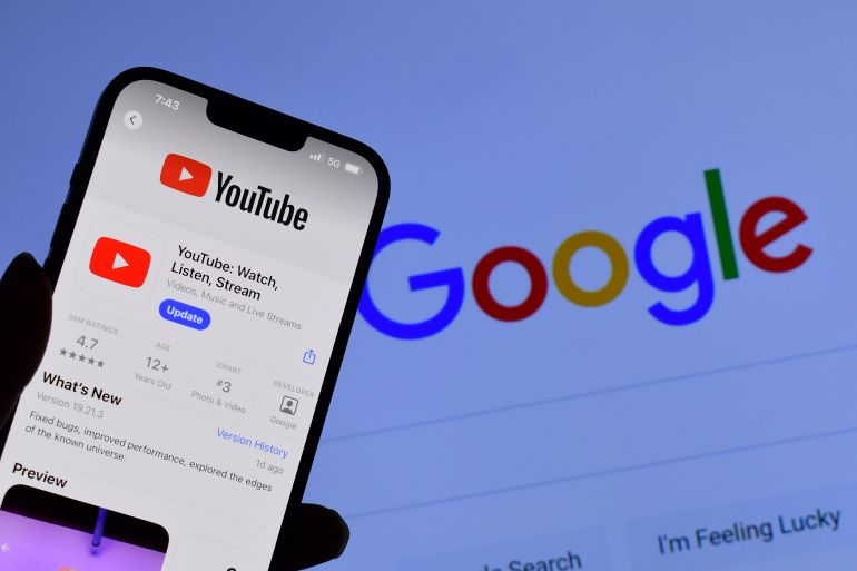 SALT LAKE CITY, UTAH, USA - MAY 31, 2024: Man holds smart phone with YouTube application on the screen. YouTube is an American online video sharing platform owned by Google.