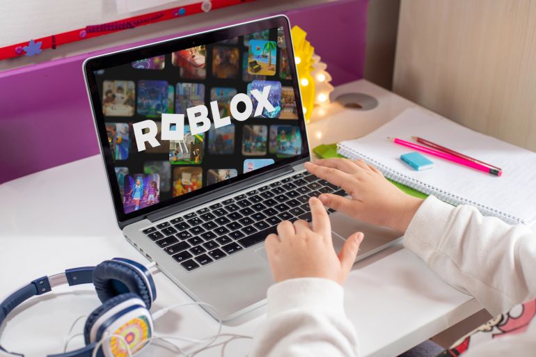 Antalya, Turkey - May 23, 2025: Little girl playing Roblox, a game very popular among children