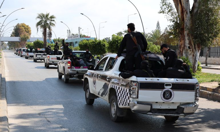 syria2-1750860742 Members of Syrian security forces ride on back of vehicles in Latakia, after hundreds were reportedly killed in some of the deadliest violence in 13 years of civil war, pitting loyalists of deposed President Bashar al-Assad against the country's new Islamist rulers, Syria March 9, 2025. REUTERS/Haidar Mustafa