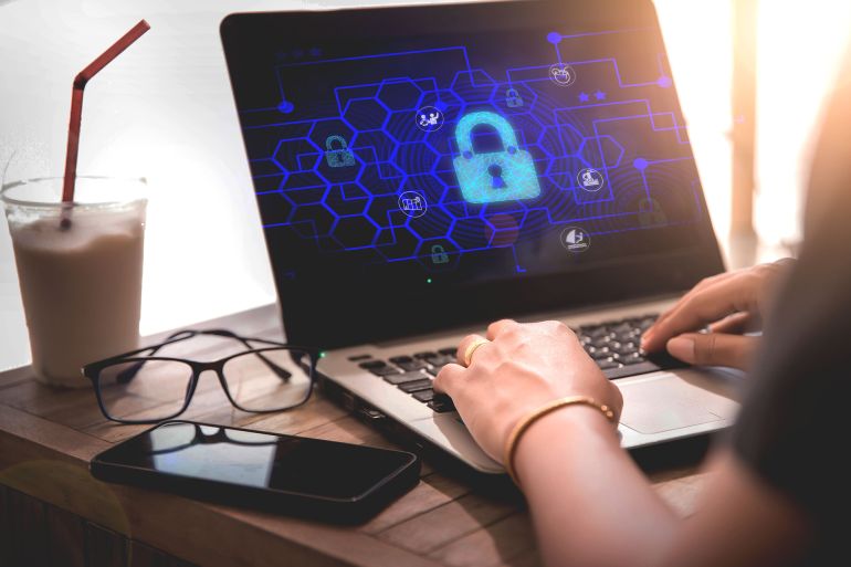 Business people protect personal information on computers, privacy concepts of data protection, travel transactions, cyber security networks, padlock icons and internet technology networks.