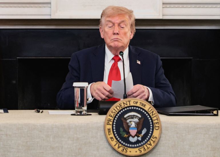 56465-1759961177 U.S. President Donald Trump holds a note that was handed to him by U.S. Secretary of State Marco Rubio during a roundtable on antifa, an anti-fascist movement Trump designated a domestic "terrorist organization" via executive order on September 22, at the White House in Washington, D.C., U.S., October 8, 2025. REUTERS/Evelyn Hockstein TPX IMAGES OF THE DAY الولايات المتحدة الرئيس دونالد ترامب يحمل مذكرة سلمتها له الولايات المتحدة. وزير الخارجية ماركو روبيو خلال مائدة مستديرة حول أنتيفا، وهي حركة مناهضة للفاشية، صنف ترامب "منظمة إرهابية" محلية بموجب أمر تنفيذي في 22 سبتمبر، في البيت الأبيض في واشنطن العاصمة، الولايات المتحدة، 8 أكتوبر 2025. رويترز/إيفلين هوكشتاين صور اليوم من TPX