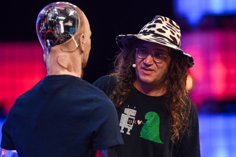 6tgy6t-1762268354 LISBON, PORTUGAL - NOVEMBER 07: Ben Goertzel and Han The Robot, of Hanson Robotics on Centre Stage during the second day of Web Summit 2018, the global technology conference hosted annually on November 7, 2018 in Lisbon, Portugal. In 2018, more than 70,000 attendees from over 170 countries will fly to Lisbon for Web Summit, including over 1,500 startups, 1,200 speakers and 2,600 international journalists. (Photo by David Fitzgerald /Web Summit via Getty Images)