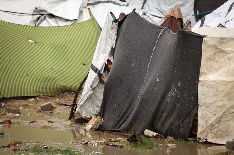 80-2-1764154863 GAZA CITY, GAZA - NOVEMBER 25: A view of the Shujaiya neighborhood after rainfall that flooded tents and left puddles of water and mud throughout the area in Gaza City, Gaza on November 25, 2025. Conditions for displaced residents whose homes were destroyed in Israeli attacks, worsening as they continue to struggle not only with the devastation of the conflict but also with the deteriorating weather conditions. ( Khames Alrefi - Anadolu Agency )