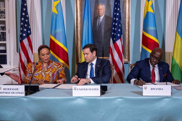 afp_680c0a4b75c2-1745619531 US Secretary of State Marco Rubio (C), Rwandan Foreign Minister Olivier Nduhungirehe (R) and Democratic Republic of the Congo Foreign Minister Therese Kayikwamba Wagner sign a Declaration of Principles between the two countries in the Treaty Room of the State Department in Washington, DC, on April 25, 2025.