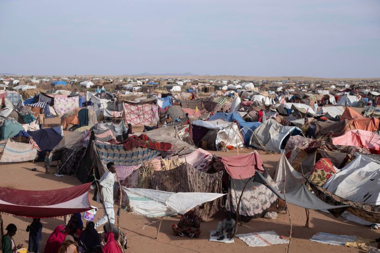 TOPSHOT - Makeshift shelters erected by displaced Sudanese who fled El-Fasher after the city fell to the Rapid Support Forces (RSF), make up the Um Yanqur camp, located on the southwestern edge of Tawila, in war-torn Sudan's western Darfur region on November 3, 2025.