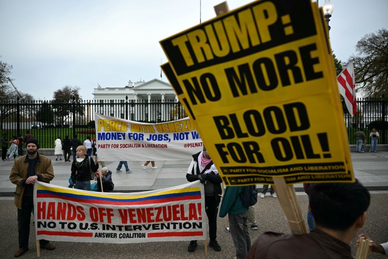 People take part in a "Peace with Venezuela" protest against the US military deployment in Latin America in front of the White House in Washington, DC, on November 15, 2025. (Photo by Drew ANGERER / AFP)