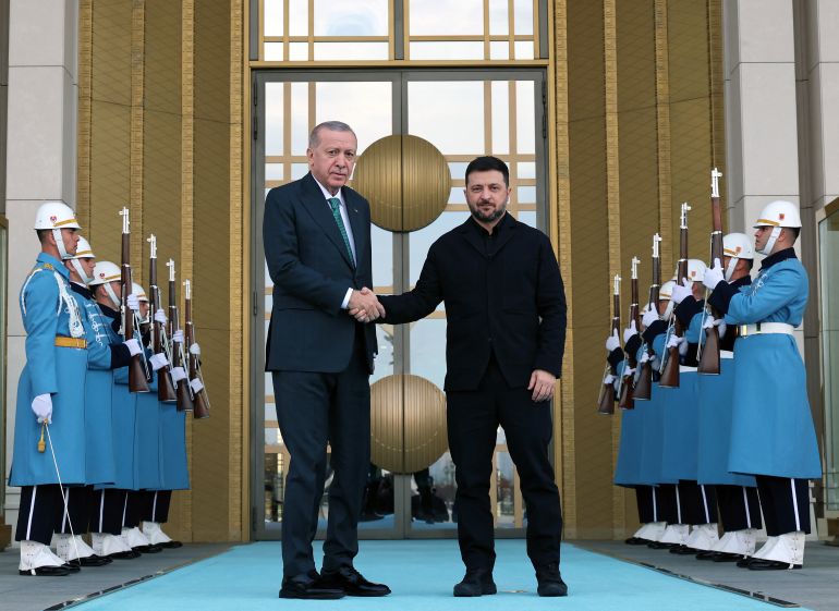 TOPSHOT - This handout photograph taken and released by Turkish Presidency Press Office on November 19, 2025, shows Turkish President Recep Tayyip Erdogan (L) shaking hands with Ukrainian President Volodymyr Zelensky (R) during an official welcoming cerenomy at the Presidential Complex in Ankara.