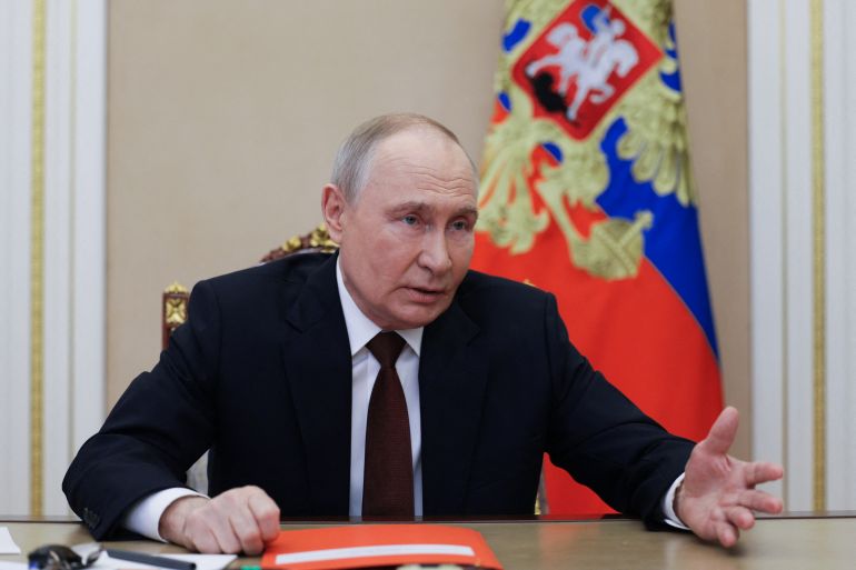 afp_692193d6d41c-1763808214 In this pool photograph distributed by the Russian state agency Sputnik, Russia's President Vladimir Putin chairs a Security Council meeting via a videoconference at the Kremlin in Moscow on November 21, 2025. (Photo by Gavriil Grigorov / POOL / AFP)