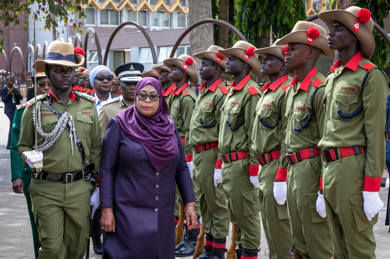 afp_6922eb1b313e-1763896091 Tanzania's President Samia Suluhu Hassan (2nd L) inspects a guard of honour during her arrival at the Tanzanian Parliament for the official inauguration of the 13th Parliament in Dodoma on November 14,