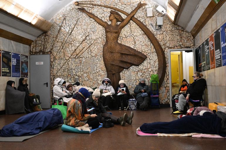 afp_69258e922217-1764069010 People take shelter at a metro station during an air attack in Kyiv on November 25, 2025, amid the Russian invasion of Ukraine.