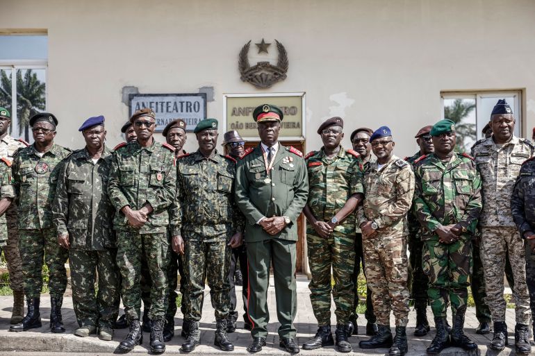 afp_692859208058-1764251936 Guinea Bissau Army general Horta N'Tam (C) poses with other military leaders after being sworn in as the transition leader and the leader of the High Command in Bissau on November 27, 2025.