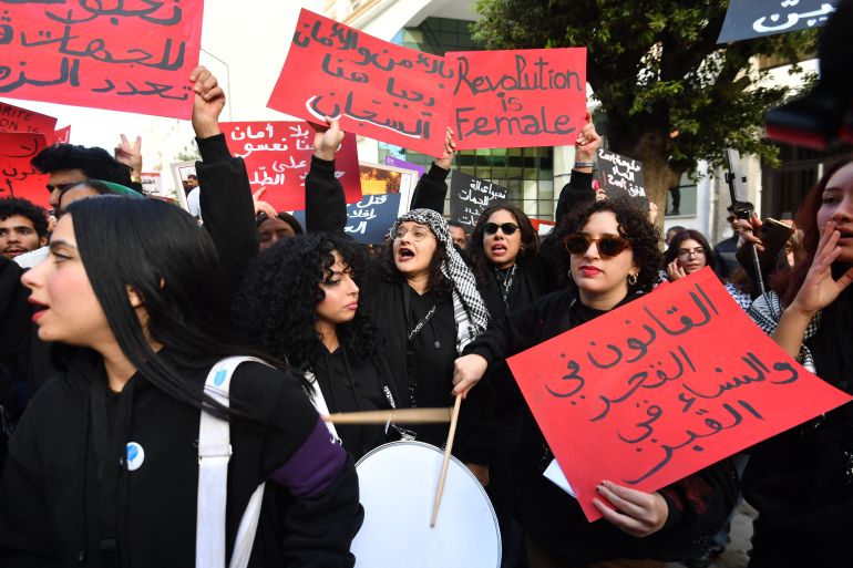 afp_692b3c9c723d-1764441244 Tunisians shout slogans against the president and raise placards during a demonstration organised by NGOs and political parties demanding the release of political prisoners and greater freedom of expression in Tunis on November 29, 2025.