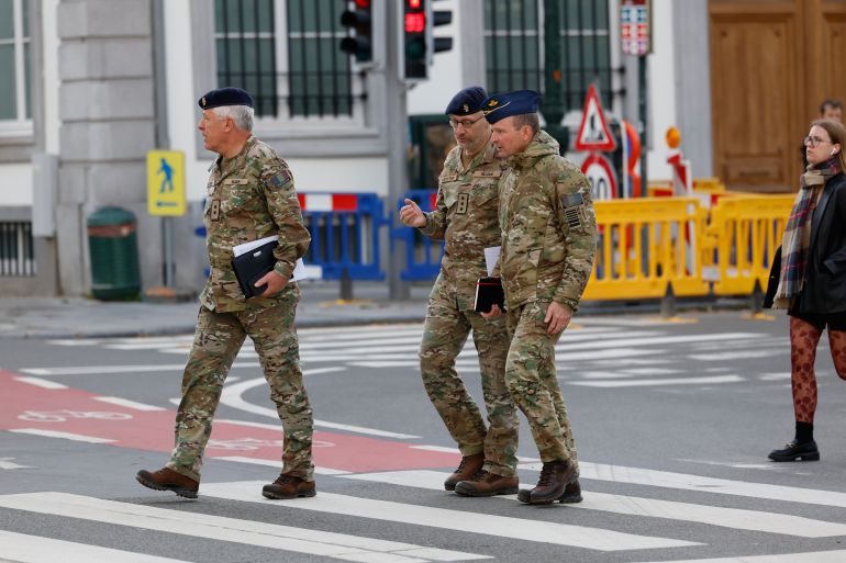 ap25310337951465-1762470655 From left, General-major Stephane Dutron, Chief of Drones and Innovation Taskforce Lt. General Michel Van Strythem and General Frederik Vansina arrive for a meeting of the National Security Council in Brussels, after recent drone sightings in Belgium, Thursday, Nov. 6, 2025. (AP Photo/Geert Vanden Wijngaert)