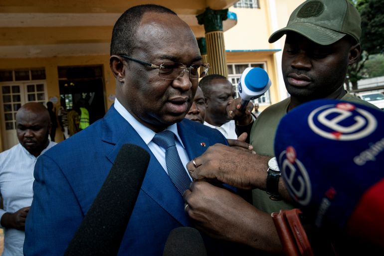 ap_68ecc661ad720-1760347745-1 Presidential challenger Anicet-Georges Dologuele speaks to the media after casting his vote at the town hall polling station in the capital Bangui, Central African Republic, Sunday, Dec. 27, 2020. Voting has begun in Central African Republic's presidential and legislative elections after a campaign period marked by violence between rebels and government forces. (AP Photo)