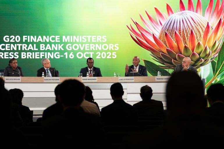 ap_69104cf691656-1762675958 South Africa's Reserve Bank Governor Lesetja Kganyago, second from right, speaks during the G20 news conference at World Bank/IMF Annual Meetings at the International Monetary Fund (IMF) headquarters in Washington, Thursday, Oct. 16, 2025. (AP Photo/Jose Luis Magana)