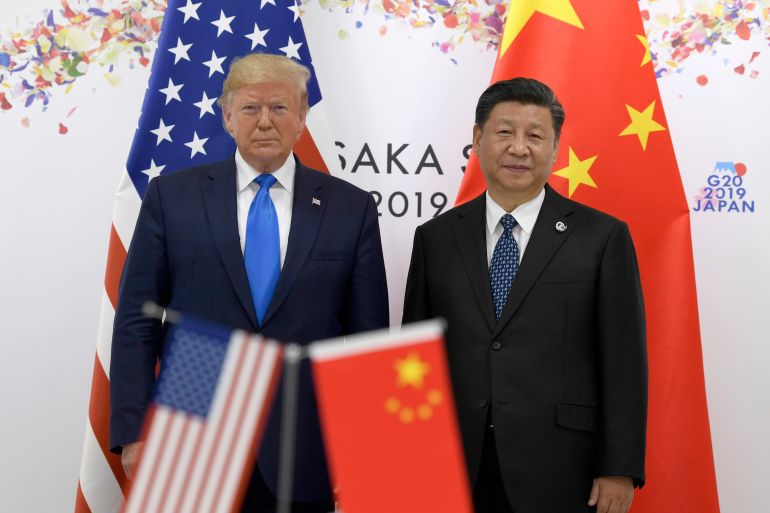 ap_69104d1c9054b-1762675996 FILE - President Donald Trump, left, poses for a photo with Chinese President Xi Jinping during a meeting on the sidelines of the G-20 summit in Osaka, Japan, June 29, 2019. (AP Photo/Susan Walsh, File)