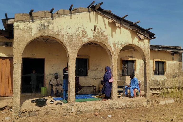 Mourners gather at the house of Hassan Yakubu Makuku, vice principal of the Government Girls Comprehensive Secondary School, where gunmen on Monday attacked the school dormitory, abducted schoolgirls, and killed him, in Kebbi, Nigeria, Tuesday, Nov. 18, 2025. (AP Photo/Tunde Omolehin)