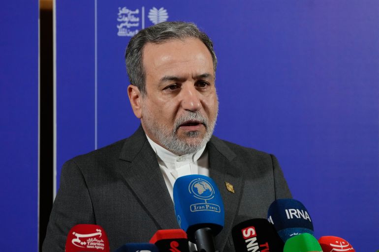 ap_691f363c6d928-1763653180 Iranian Foreign Minister Abbas Araghchi speaks in a new briefing after attending a conference titled "International Law Under Assault: Aggression and Self-Defense," in Tehran, Iran, Sunday, Nov. 16, 2025. (AP Photo/Vahid Salemi)