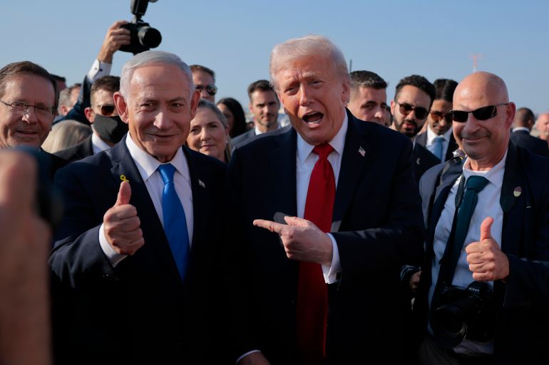 TEL AVIV, ISRAEL - OCTOBER 13: U.S. President Donald Trump speaks to Israeli Prime Minister Benjamin Netanyahu at Ben Gurion International Airport before boarding his plane to Sharm El-Sheikh, on October 13, 2025 in Tel Aviv, Israel. President Trump is visiting the country hours after Hamas released the remaining Israeli hostages captured on Oct. 7, 2023, part of a US-brokered ceasefire deal to end the war in Gaza. (Photo by Chip Somodevilla/Getty Images)