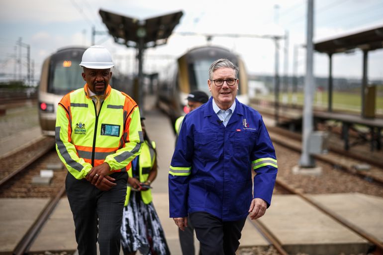getty_69206a46be-1763732038 JOHANNESBURG, SOUTH AFRICA – NOVEMBER 21: Britain's Prime Minister Keir Starmer (R) speaks CEO of Gautrain Management Agency Tshepo Kgobe (L) as he visits Johannesburg's Gautrain depot workshop in Midrand, ahead of the G20 Summit that starts tomorrow, on November 21, 2025 in Johannesburg, South Africa. The Gautrain carriages are made in Alstom's factory in Derby, UK. During his trip, British Prime Minister Keir Starmer is scheduled to take part in several engagements and bilateral meetings on Friday, before the G20 summit kicks off on Saturday. (Photo by Henry Nicholls - WPA Pool/Getty Images)