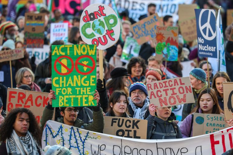 GLASGOW, SCOTLAND - NOVEMBER 15: Demonstrators attend a protest as Glasgow takes part in Global Day Of Climate Action on November 15, 2025 in Glasgow, Scotland. Scotland's Climate March will be part of a day of coordinated global action taking place during the UN climate talks at COP30 in Brazil. (Photo by Jeff J Mitchell/Getty Images)