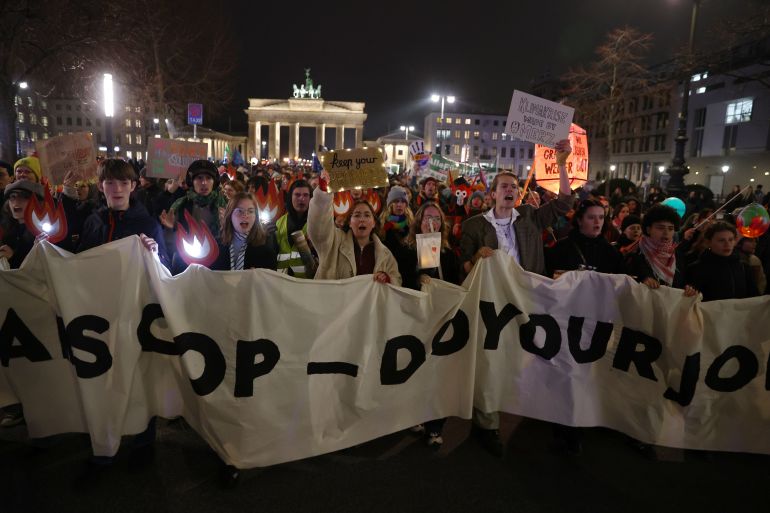 BERLIN, GERMANY - NOVEMBER 14: Climate activists of the Fridays for Future movement gather at the Brandenburg Gate to demand that Chancellor Friedrich Merz do more to ensure Germany reaches its climate goals on November 14, 2025 in Berlin, Germany. The protest is coinciding with the ongoing UNFCCC COP30 climate conference in Belem, Brazil. (Photo by Maryam Majd/Getty Images)