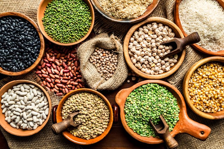 gettyimages-1178796552-1762013622 Top view of leguminous seeds on rustic wood table