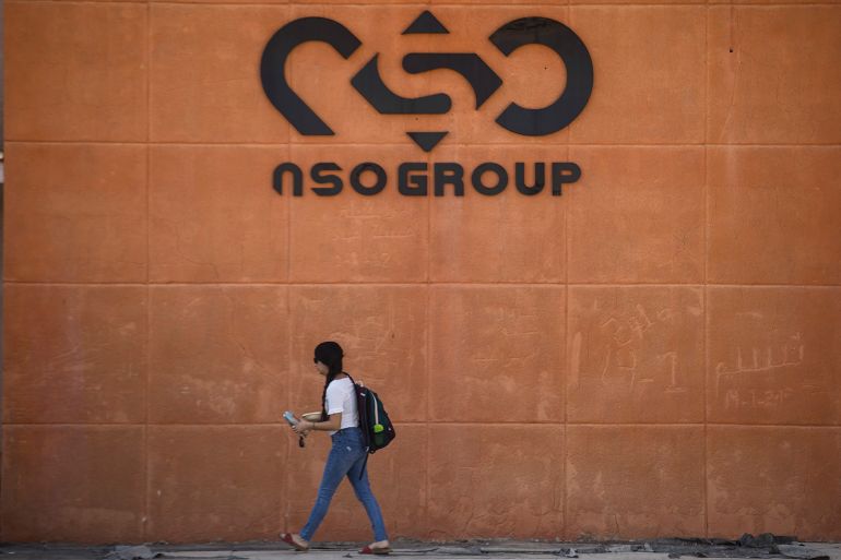 gettyimages-1236496832-1760253696 SAPIR, ISRAEL - NOVEMBER 11: A woman walks by the building entrance of Israeli cyber company NSO Group at one of its branches in the Arava Desert on November 11, 2021 in Sapir, Israel. The company, which makes the spyware Pegasus, is being sued in the United States by WhatsApp, which alleges that NSO Group's spyware was used to hack 1,400 users of the popular messaging app. An US appeals court ruled this week that NSO Group is not protected under sovereign immunity laws. (Photo by Amir Levy/Getty Images)