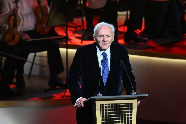 gettyimages-2194436744-1763480539 RIYADH, SAUDI ARABIA - JANUARY 17: Sir Anthony Hopkins speaks onstage at the "Life Is A Dream" concert - Composer Sir Anthony Hopkins with the Royal Philarmonic Orchestra for Riyadh Season 2025 live broadcast on MBC on January 17, 2025 in Riyadh, Saudi Arabia. (Photo by Cedric Ribeiro/Getty Images for GEA)