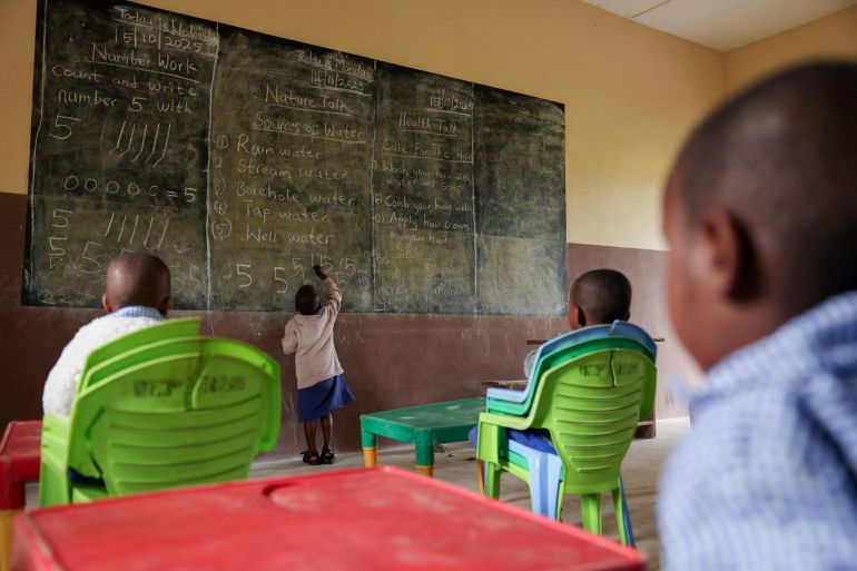 nigeria-1763032596 A boy accused of witchcraft by his mother writes on a blackboard in a class exercise in Eket, Akwa Ibom state, Nigeria, October 15, 2025. REUTERS/Sodiq Adelakun