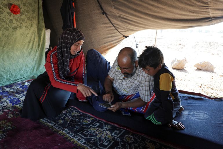 reuters_690f4258-1762607704 Faisal Sbeih and his wife, Fasl, who fled sectarian fighting in Syria's Sweida province, sit inside their tent in the Daraa countryside, Syria, September 15, 2025. REUTERS/Khalil Ashawi