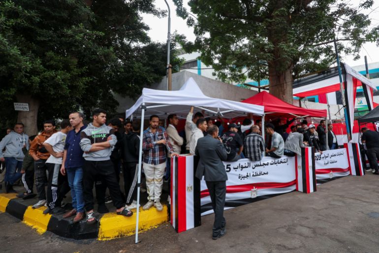 People queue to vote at a school, during the first round of Egypt's parliamentary elections in Giza, Egypt, November 10, 2025. REUTERS/Mohamed Abd El Ghany