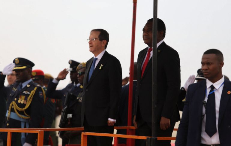 reuters_69145544-1762940228 Israel's President Isaac Herzog is welcomed by Zambia's President Hakainde Hichilema upon his arrival, marking the first-ever state visit by an Israeli head of state, at Kenneth Kaunda International Airport in Lusaka, Zambia, October 10, 2025. Herzog is in the country for a two-day visit. REUTERS/Moses Mwape