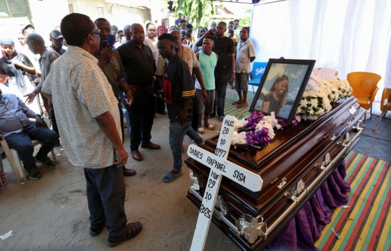 reuters_692725a1-1764173217 Relatives gather near the coffin of Dainess Raphael Sisa, 28, who was shot dead during election-related unrest in the Tabata Shule area on October 29, in Kibo, Ubungo district, before her burial on the outskirts of Dar es Salaam, Tanzania November 26, 2025. REUTERS/Emmanuel Herman
