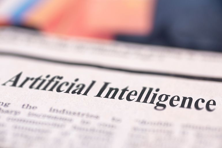 Artificial Intelligence written newspaper close up shot to the text.; Shutterstock ID 1021224133; purchase_order: aj; job: ; client: ; other: