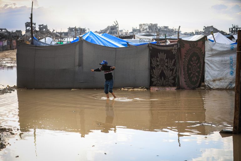 10gaza-1765358831 GAZA CITY, GAZA - DECEMBER 11: Palestinians struggle with flooding after heavy rain hits the Abu Marhil Camp in the Az-Zaytun neighborhood in Gaza City, Gaza on December 11, 2025. Conditions for displaced residents whose homes were destroyed in Israeli attacks, worsening as they continue to struggle not only with the devastation of the conflict but also with the deteriorating weather conditions. ( Hamza Z. H. Qraiqea - Anadolu Agency )